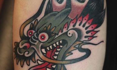 Small Dragon Face Tattoo: Unleashing the Power of Mythology on Your Skin