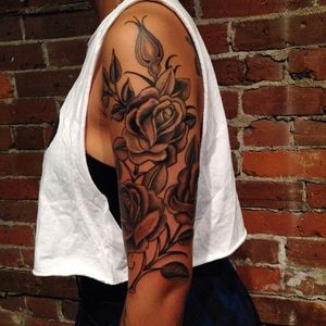 A beautiful half sleeve. Tattoo on dark skin by Billy DeCola, inspired by a rose design of Luke Wessman. #BillyDeCola #lukewessman #flower #floral #blackandgrey