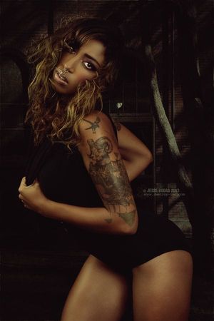Love this etching-style tattoo on model Milloux Suicide! She rocks it! Photo by Jesse Bodas