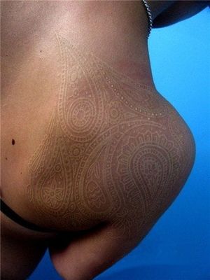 A white ink tattoo on dark skin is an option, but make sure your tattoo artist knows what he is doing. #whiteink #geometric
