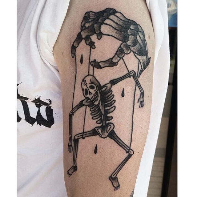 Death is the puppet master of our lives if we don't pay attention. By Rae Razael.