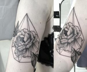 Peony in geometric shape tattoo by Clarisse Amour Nguyen (Instagram @clarisseamourtattoo).