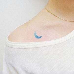 Watercolor style blue moon collarbone tattoo by Banul, Instagram / Little Tattoos