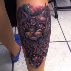 Love this galactic three eyed cat tattoo! Unknown artist
