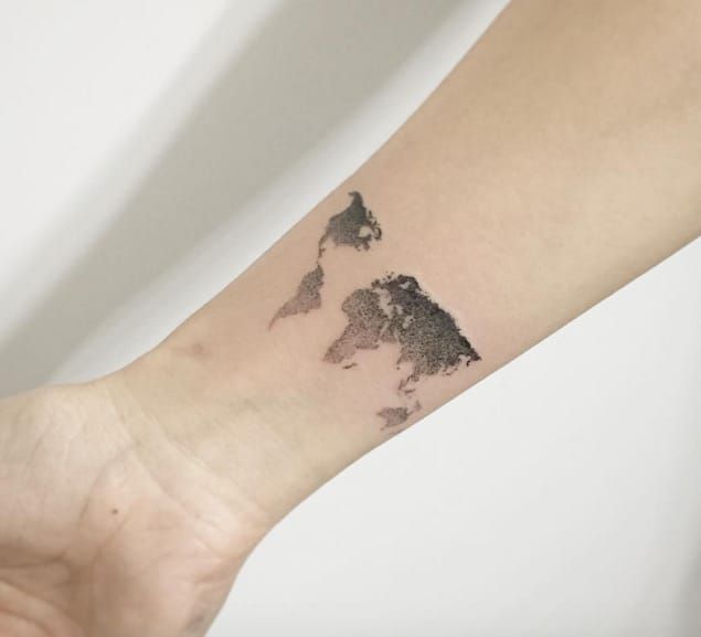 world map tattoo arm