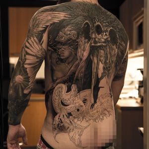 Epic backpiece in progress by Niki Norberg, with a valkyrie, Yggdrasil and Nidhogg.
