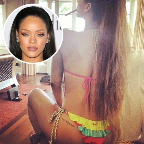 Rihanna has a nice little inscription in Tibetan saying "love" right above her left cheek. via lifeandstylemag.com