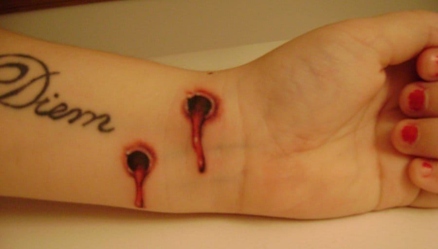 vampire bite tattoo on wrist