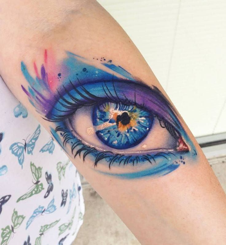Microrealistic eye tattoo on the inner forearm