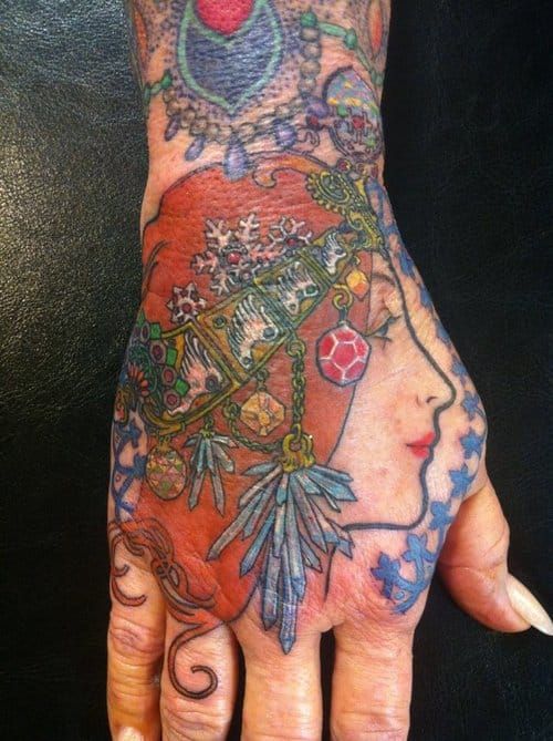 Elegant hand tattoo by Lucy Hu.