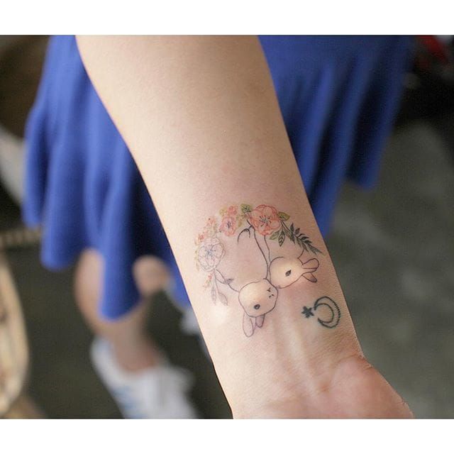 A really great idea for wrist tattoos for women that's not too imposing and not too lacklustre is a lovely South Korean-inspired piece characterised by a single needle work and pastel colours. By tattooistmuha/Instagram