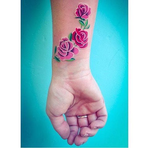 Wrist tattoos for women with solid color like this rose tattoo by Briana Juju #rose #wrist #brianajuju