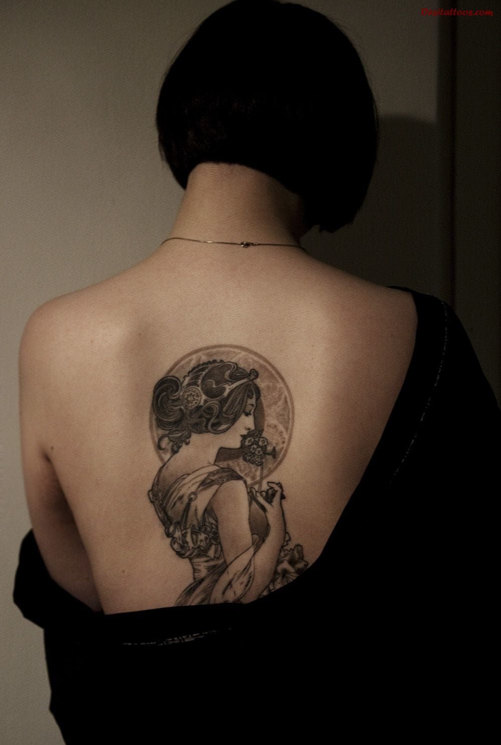 Delicate back tattoo by Electric Linda.