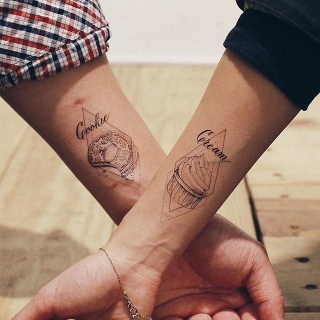 When you go together like cookies and cream. Matching couple tattoos @cottontail/Instagram #linework #cookie #cream #coupletattoo #geometric