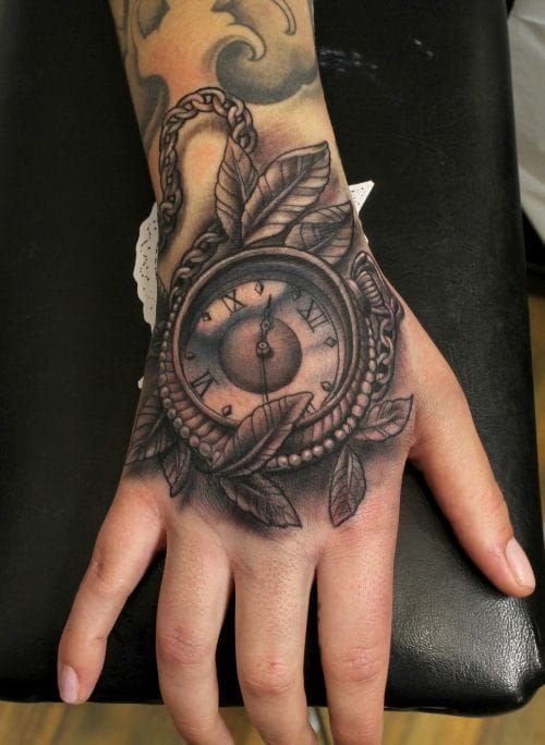 Nice Pocket Watch hand tattoo by Ion at Swahili Bob's tattoo, Sweden.