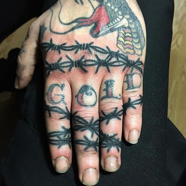 Knuckle tattoo  Knuckle tattoos Hand and finger tattoos Barbed wire  tattoos
