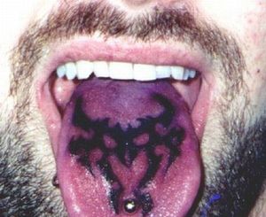 Tongue blackwork tattoo