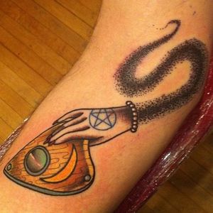 Spirit's hand guiding the planchette... Love the mystery behind this tattoo by Speck Osterhout.