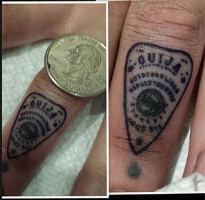 Very small planchette on the finger.
