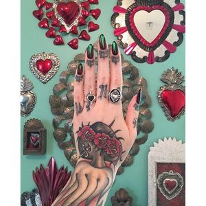 Megan Massacre shows her Sacred Heart collection, including a traditional one on her hand made by Tim Hendricks. (Instagram: @timhendricks, @megan_massacre)  #blackandgrey #traditional #sacredheart #immaculateheart