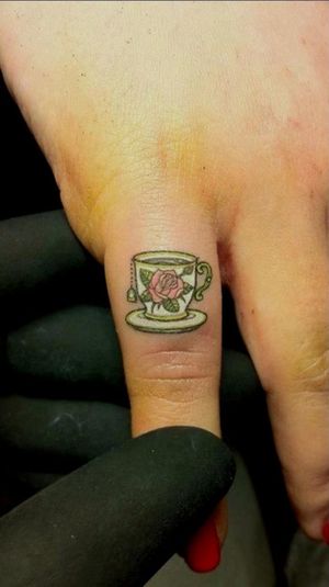 A common place to get a detailed small-piece tattoo are on the fingers. Looks so cute! Tattoo by Jorge Becerra.