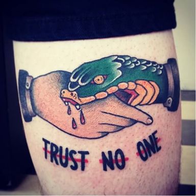 The Hand that Bites: Snake Handshake Tattoos