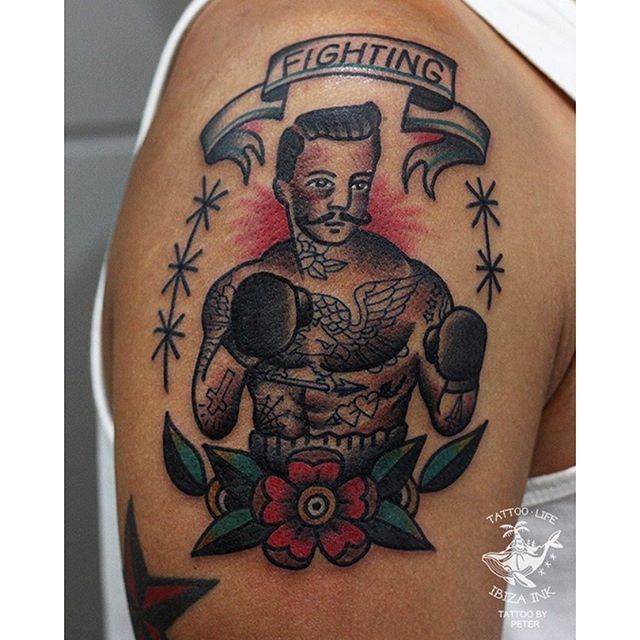 Traditional boxer tattoo on the right forearm