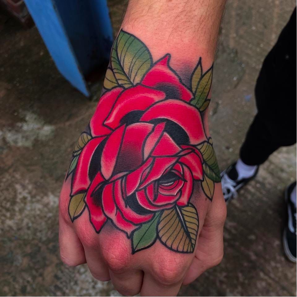 Realistic red rose tattoo on the right hand Done at