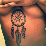 Dreamcatcher tattoo via Pinterest #dreamcatcher #tribal #nativeamerican #feathers #blackwork #sternum