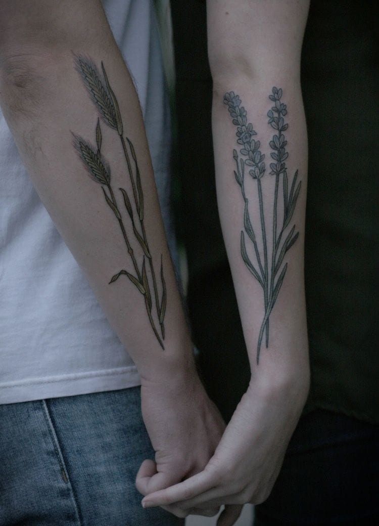 Nature has no sex and botanical tattoos suit both men and women. Here a very romantic pair of couple tattoos by Kirsten Holliday.