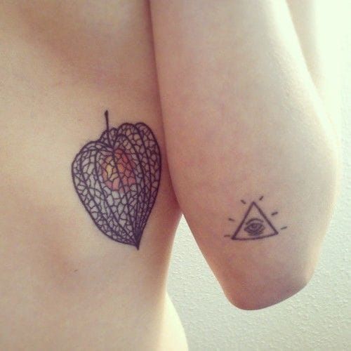 The Physalys fruit with his delicate lantern shape and colorful heart is a pretty idea for a tattoo. Here by Koopa.