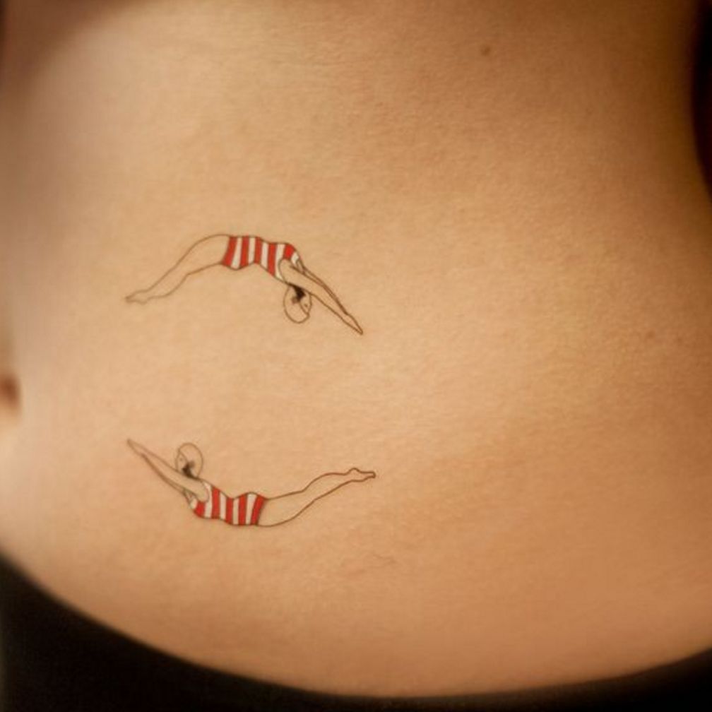 Fine line swimmer tattoo on inner forearm