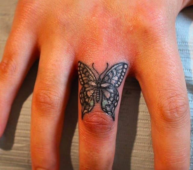 Tribal butterfly tattoo for finger
