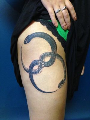 Yin and Yang Ouroboros tattoo