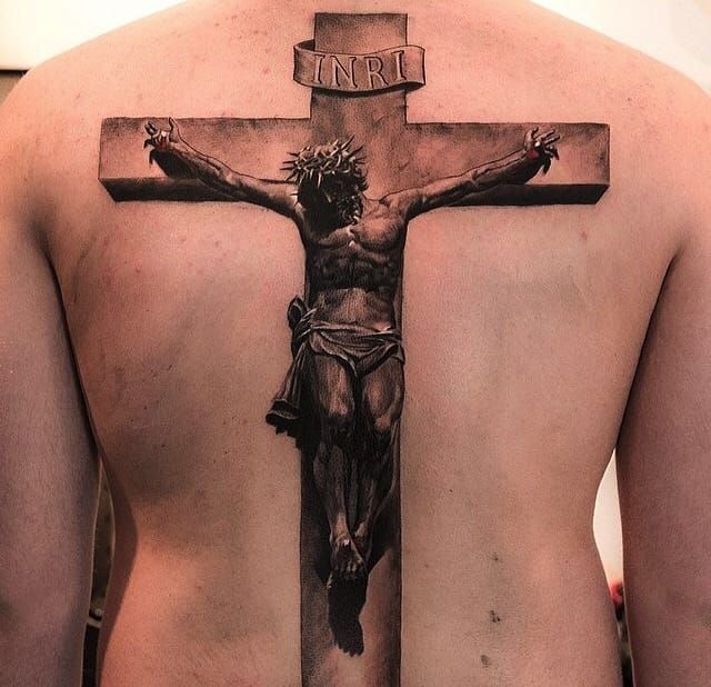 Wrist tattoo of a christian cross on Tenika.