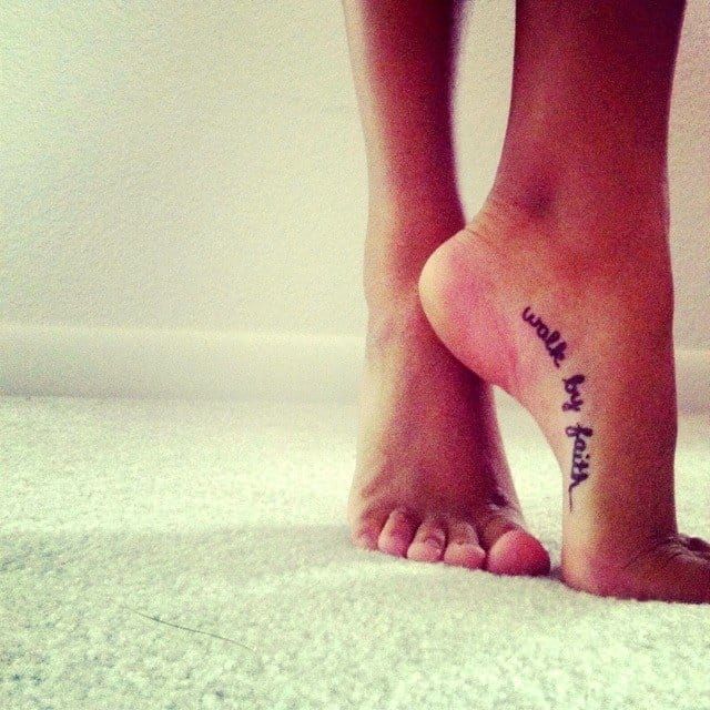 Another more discreet walk by faith script tattoo on the foot.
