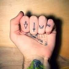 Lots of meaning in these four little finger tattoos. He came. He died. He rose. He's coming back.