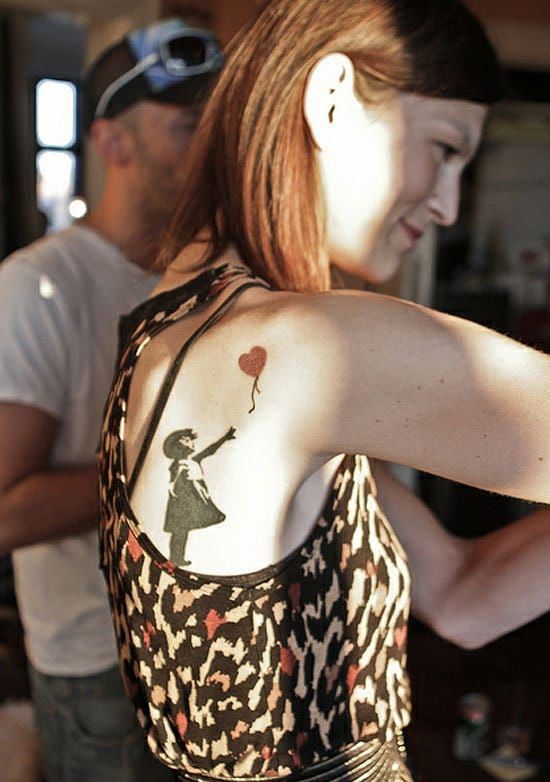 The girl with the heart balloon is one of Banksy's most famous street painting, and also one of the most coveted for tattoos. Photo by Loonyworld.