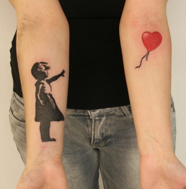 The balloon girl can make a good split tattoo, here by Tuomas Koivurinne.