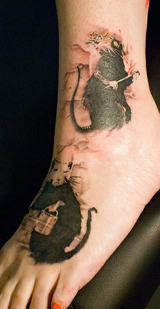 Banksy's rats are also really famos. Here on a foot, by Mez Love.