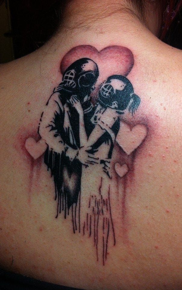 Tell us who is the tattoo artist please.