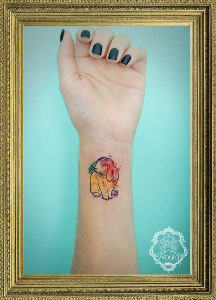 Small watercolor tattoo by Candelaria Carballo.