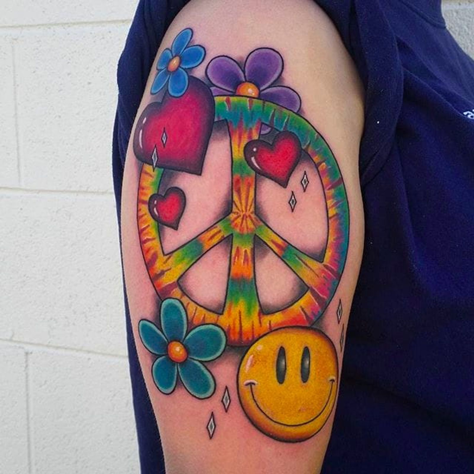 10-groovy-peace-sign-tattoos-tattoodo