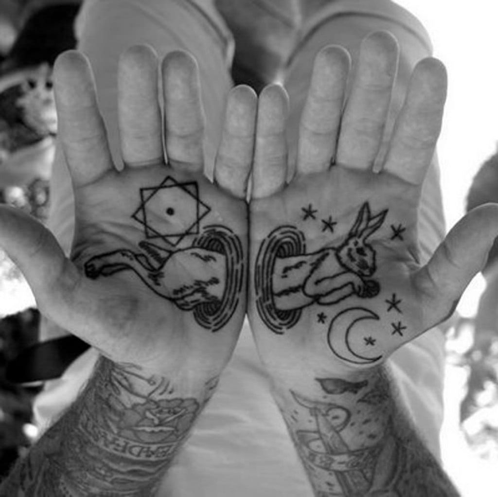 Esoteric magic rabbit on the palms! Ouch but wow! Can you tell us who is the artist?