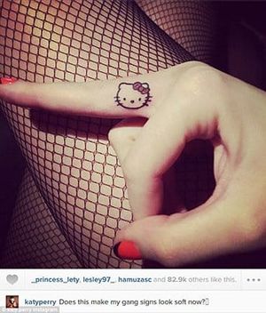 Hello Kitty finger tattoo