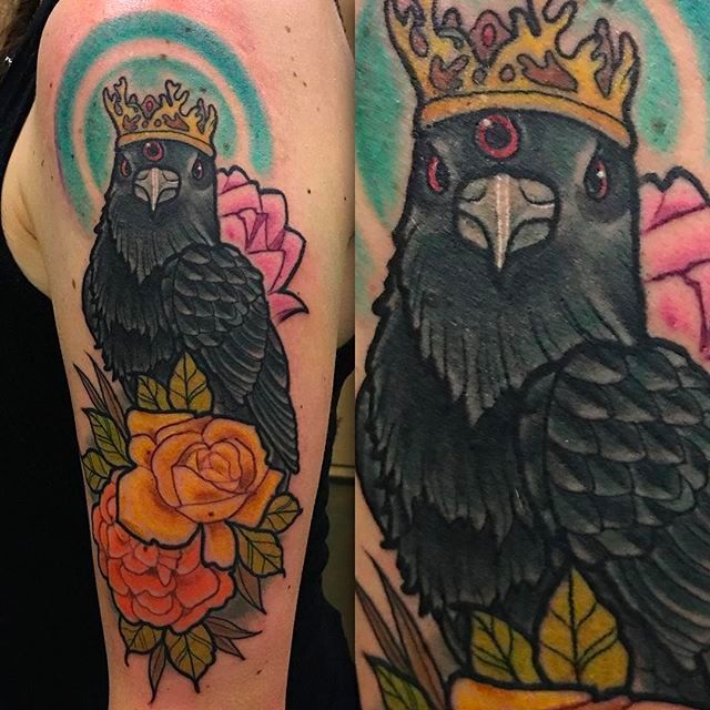 Graphic style raven tattoo on the right forearm