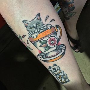 Cat in a tea cup tattoo by Chris Jenko. #traditional #tea #teacup #cat #feline #ChrisJenko