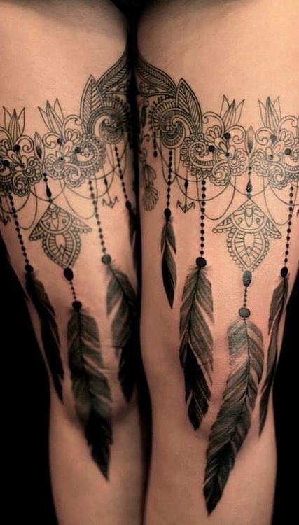 If you don't do things by half add some feathers for a bigger leg tattoo! By Dodie.