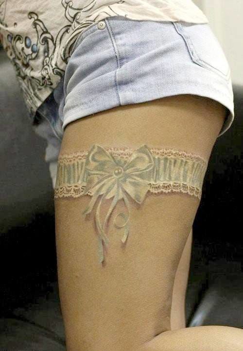 Another realistic white lacy garter with missing credits, correct that in comments if you can.