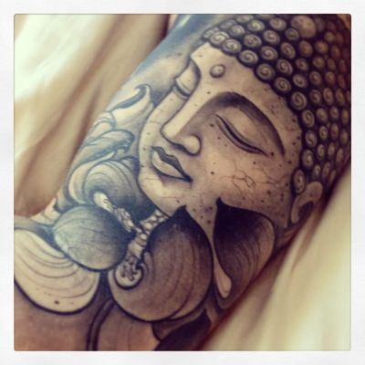 Buddha face with lotus.